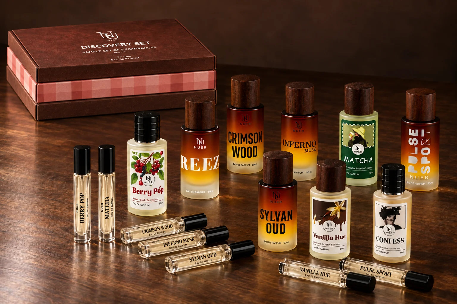 NUER fragrance collection with 50 ml bottles, 10 ml testers and stacked brown and pink discovery sets